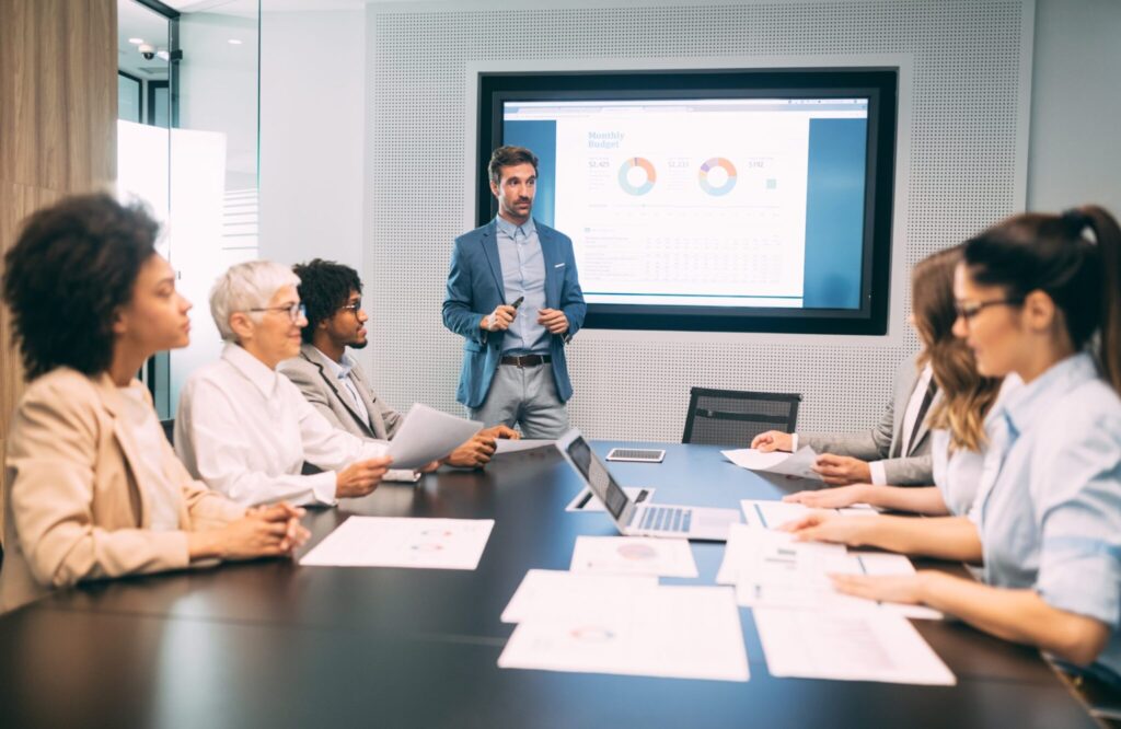 Business colleagues having meeting in conference room in office